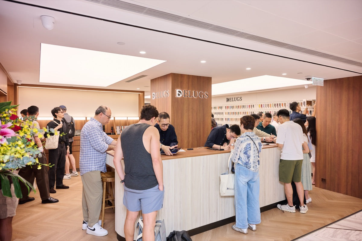 Customers at the counter on opening day at the Delugs Flagship Boutique (Hong Kong).